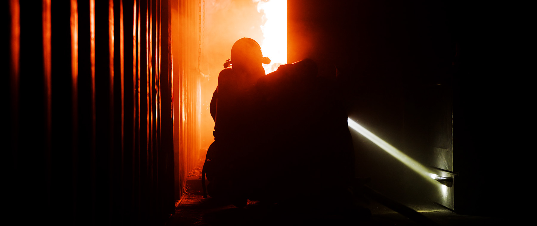 Firefighter inside burn building